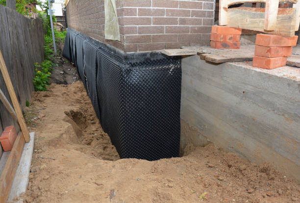 Happy homeowners after waterproofing job in Wautoma